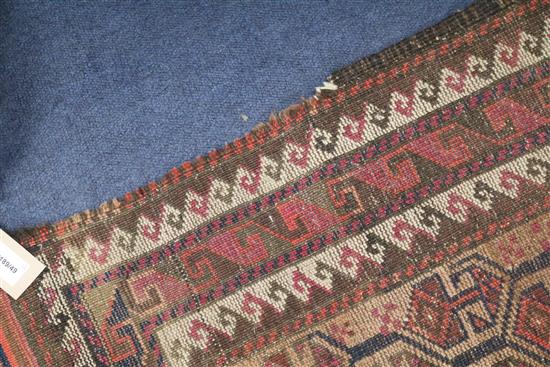 A Shiraz rug, a Bokhara saddlecloth and another rug (wear)